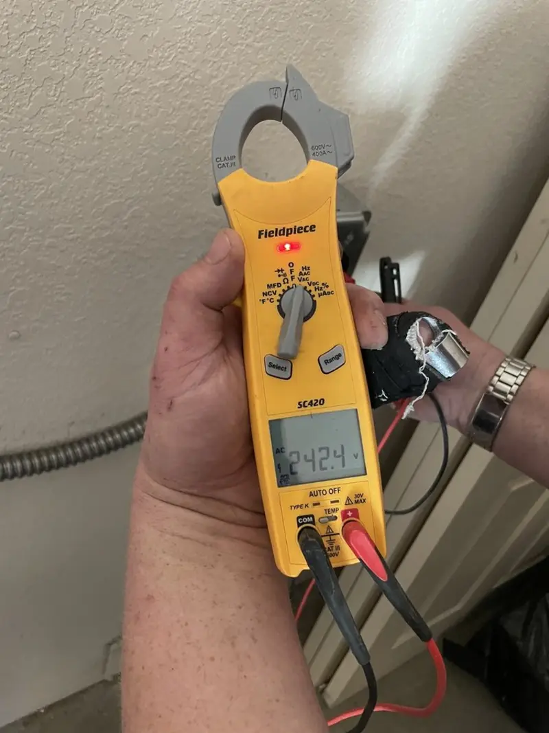 Voltage testing with clamp meter during Aluminum Wiring Replacement in Wilmington Manor